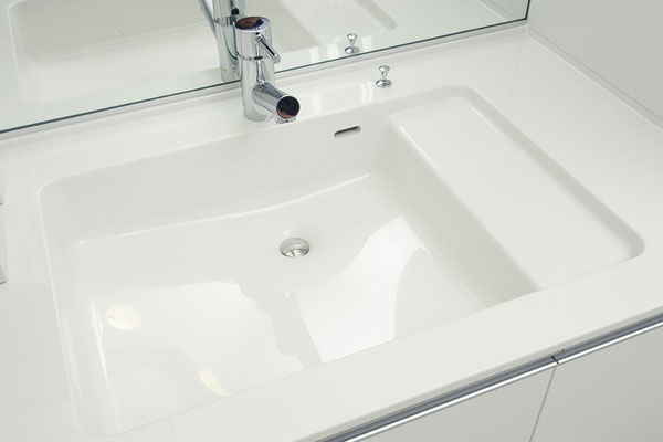 Bathing-wash room.  [Clear proof counter] Adopt an integrated counter that repel water and dirt "organic glass-based new material" has been used. There is no extra uneven, It has become a clean and easy to design (same specifications)