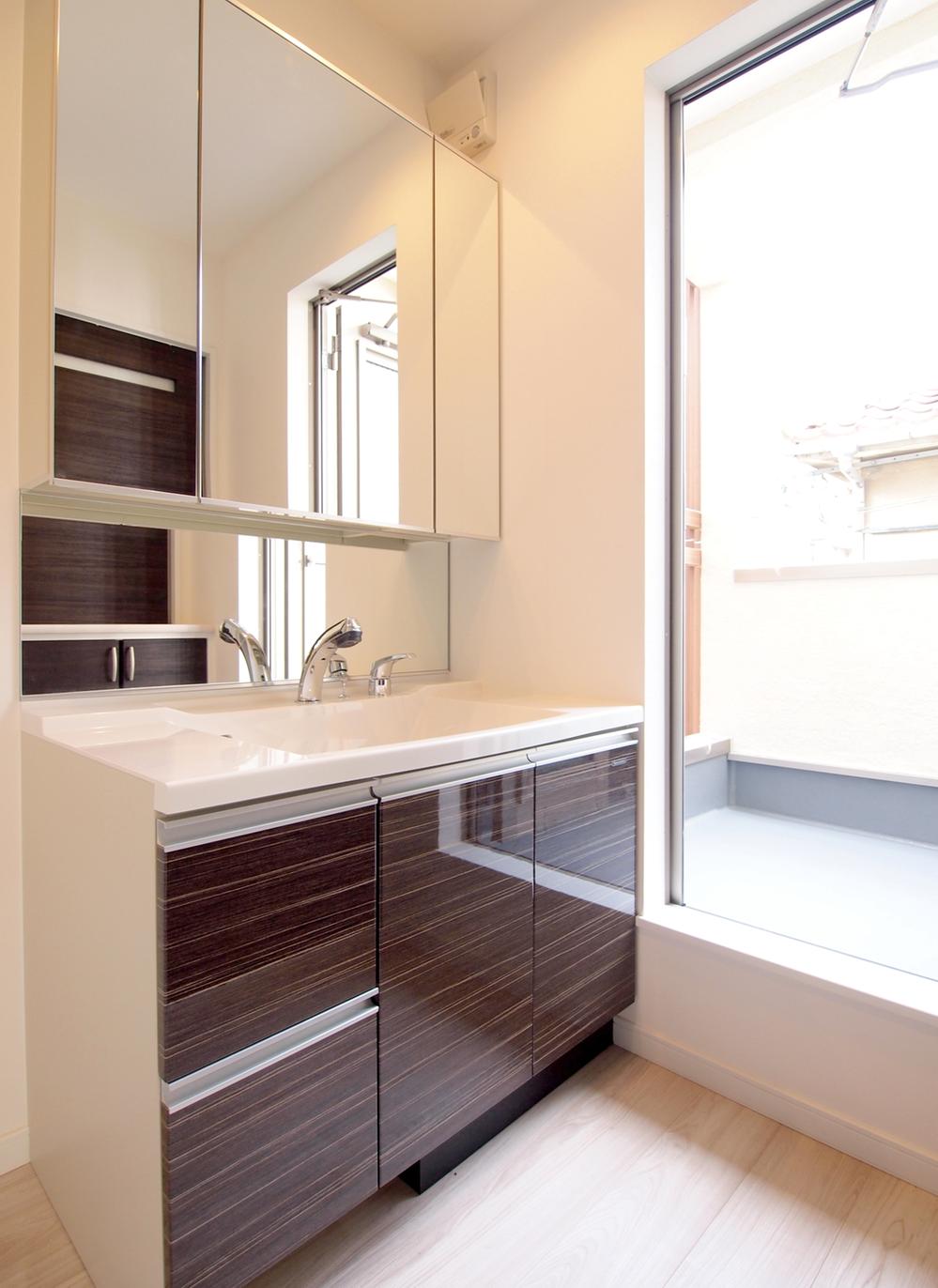 Wash basin, toilet. A balcony is also next to the wash basin. This is useful for small clothesline. 