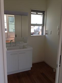 Wash basin, toilet. There is room to washroom space