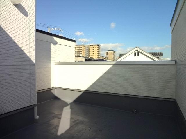 Balcony. It is with a rooftop roof balcony.