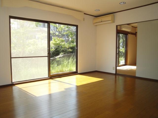 Living. It is spacious views of the garden facing the south from the large living.