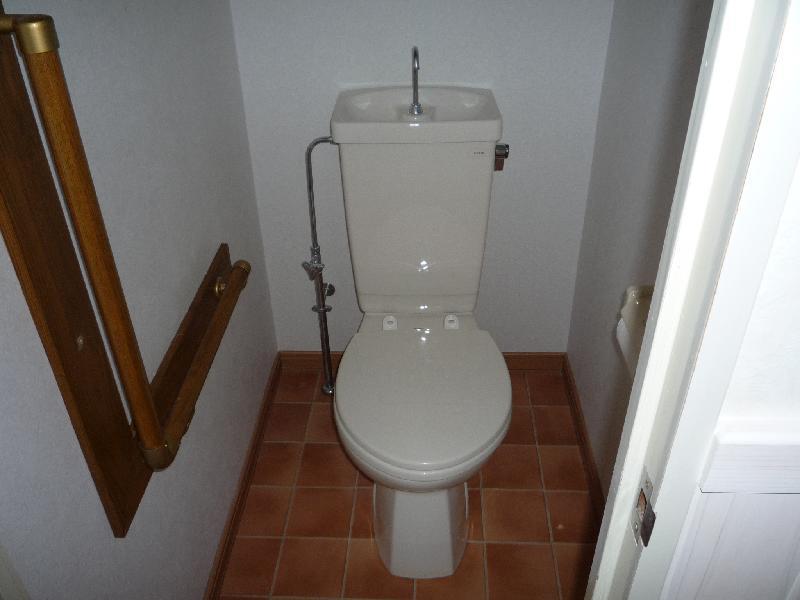 Toilet. With handrail