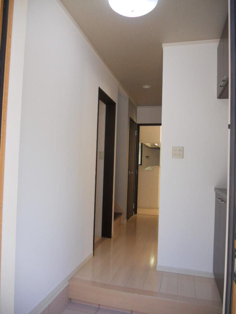 Entrance. Entrance corridor is the bright white of the flooring.