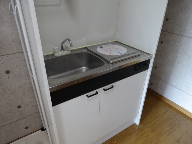 Kitchen. Convenient mini-kitchen with a stove