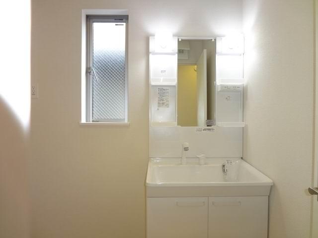 Wash basin, toilet. 2nd floor powder room. Shampoo dresser. 