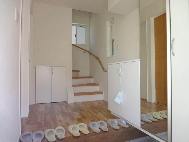 Entrance. The first floor entrance hall. Shoe box with mirror.