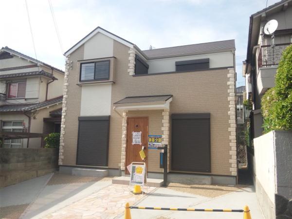 Local appearance photo. South-facing is a stately two-story.