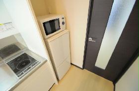 Kitchen. Two-burner electric stove is a wide kitchen