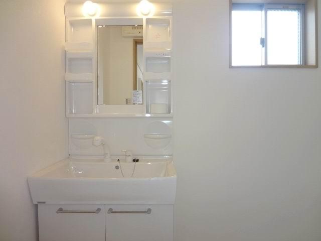Wash basin, toilet. 2nd floor powder room. Shampoo dresser.