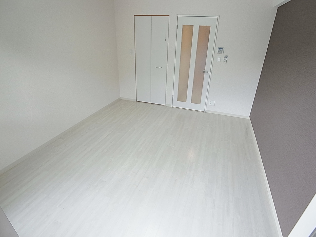 Living and room. It is a bright room where the light is plugged