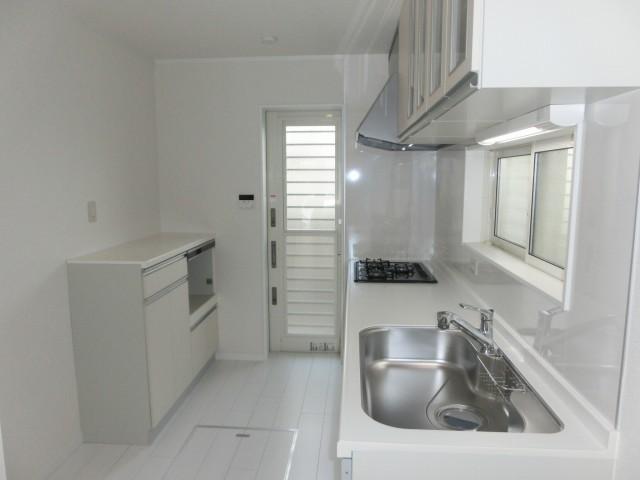 Kitchen. It is unified pointed out in white. Back door is also likely to take advantage of in the trash storage. 