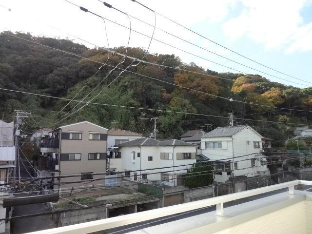 View photos from the dwelling unit. View from the second floor balcony. Yang This good in the south-west direction. Green is visible.