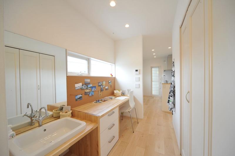 Model house photo. Moderately block the line of sight from the living room on the stairs, Work space for the wife was to be aligned with the kitchen. 