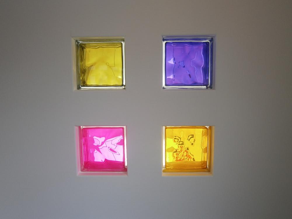 Other. Sunlight from the beautiful block glass will brighten the living