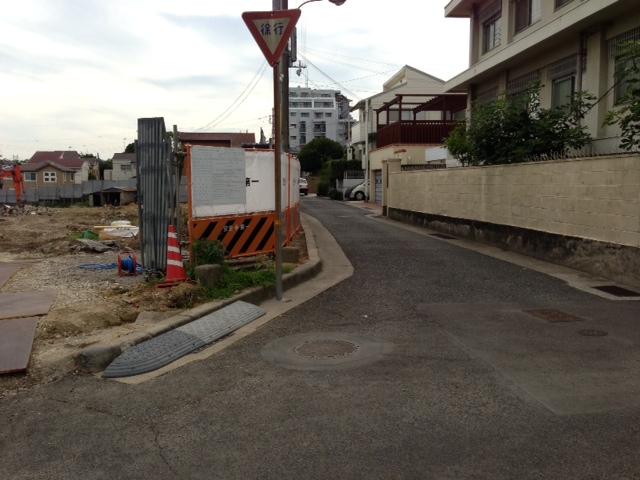 Other Environmental Photo. Front road of 80m right is the property to neighboring development land Left the wooden two-story development areas (39 units), Current Status leveling, Construction work in
