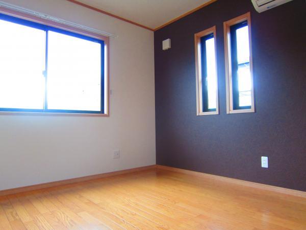 Non-living room. On one side is design wallpaper.  Please to the nursery. 