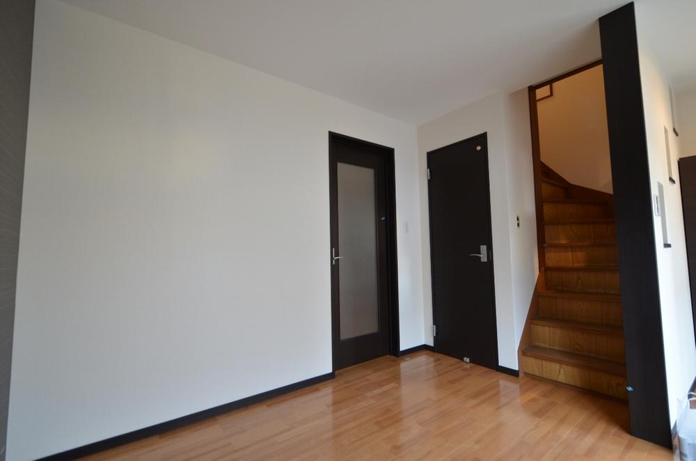 Non-living room. There is a staircase and toilets are in free space portion back of the entrance.