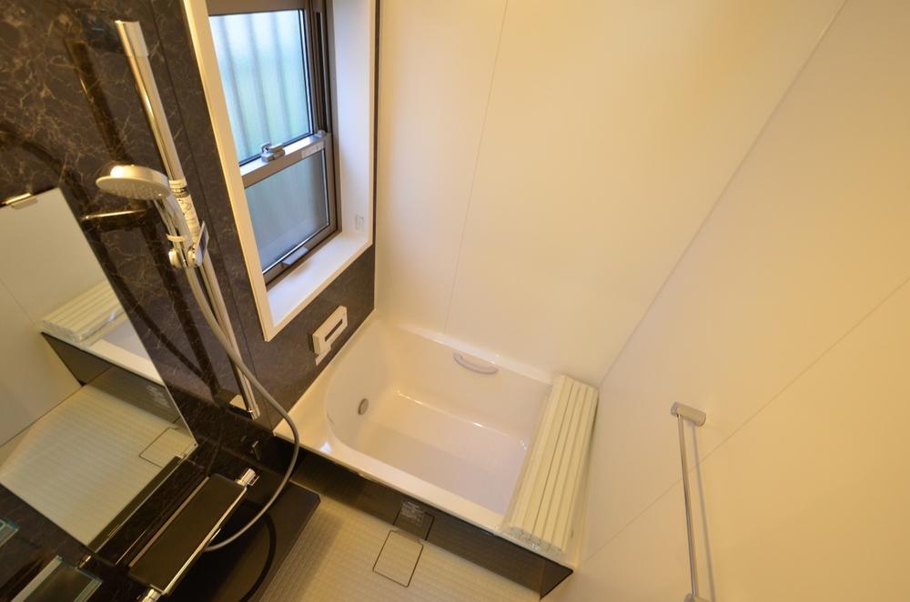 Bathroom. There is also a window in the bathroom, Since it has become a flat design is also safe for those of our elderly.