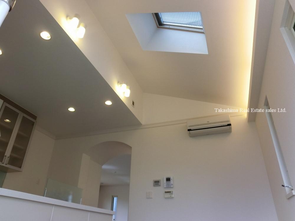 Kitchen. Dining has a ceiling high feeling of opening, It is with skylight.