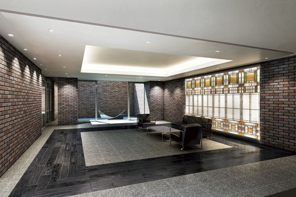 Features of the building.  [Entrance hall] Live person, To greet our valued customers gracefully, Design the entrance hall with a profound feeling of remembering the continuity of the appearance by using the tile of brick tone. By applying the stained glass on the wall, To pursue the design beauty as Yingbin space, Proud mansion in quality has been created (Rendering)