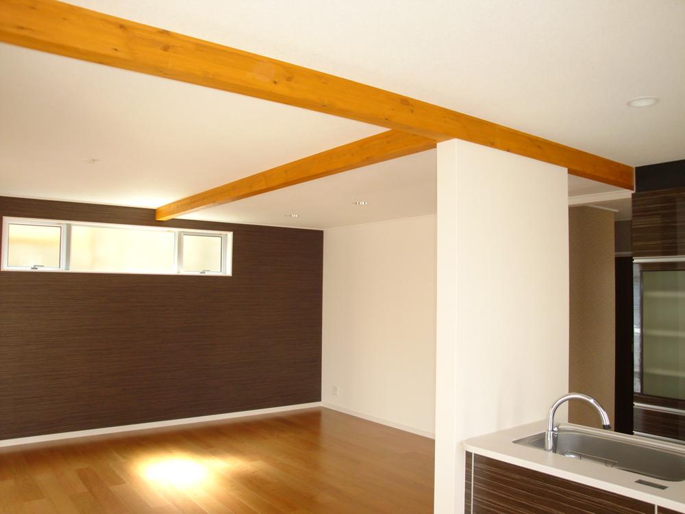 Living. Living room ceiling that utilizes a beam of structural materials