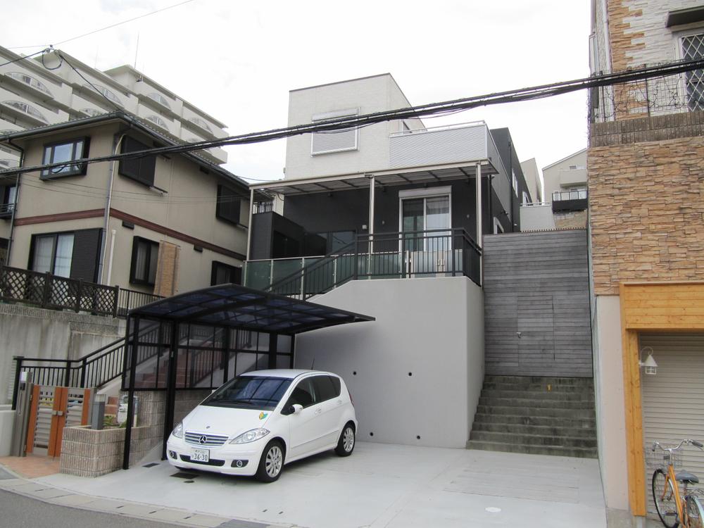 Local appearance photo. October 2009 construction of custom home. Elegant Exterior & carport. Parking is available for easy three.