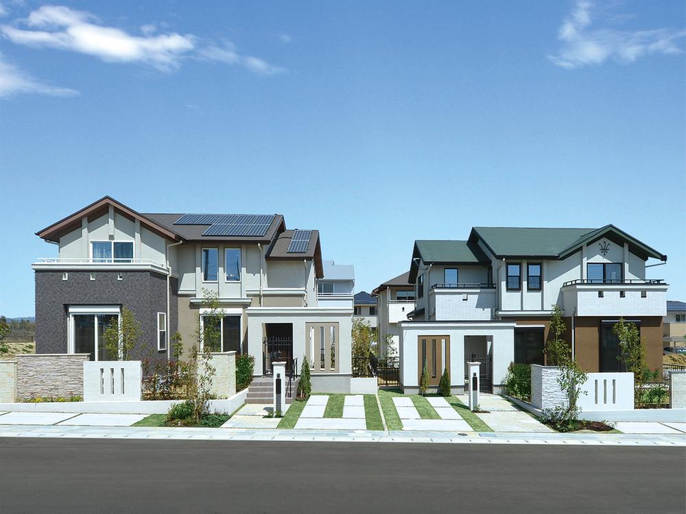 Local photos, including front road. Exterior design that has been decorated with stately gates and fence.