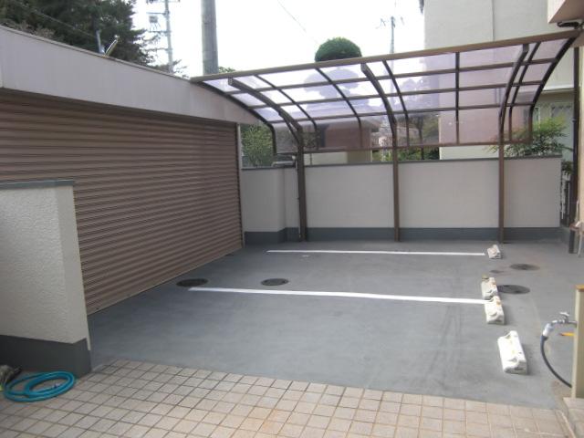 Parking lot. Parallel two parking in the electric car port with shutter