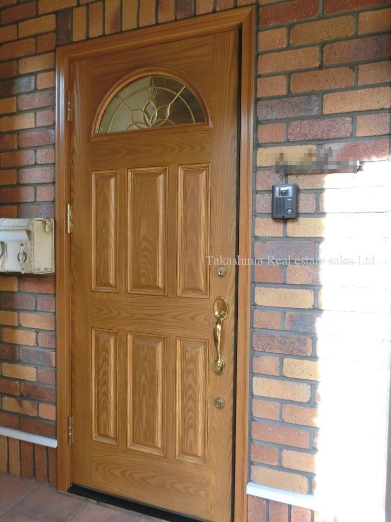 Entrance. It is the front door of the residence side.