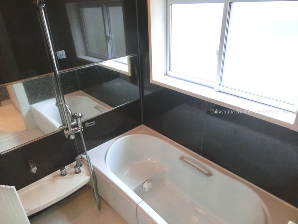 Bathroom. There are large windows in the large kitchen.