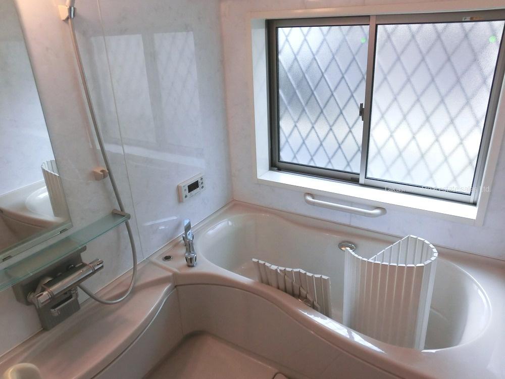 Bathroom. Bathroom has large windows.