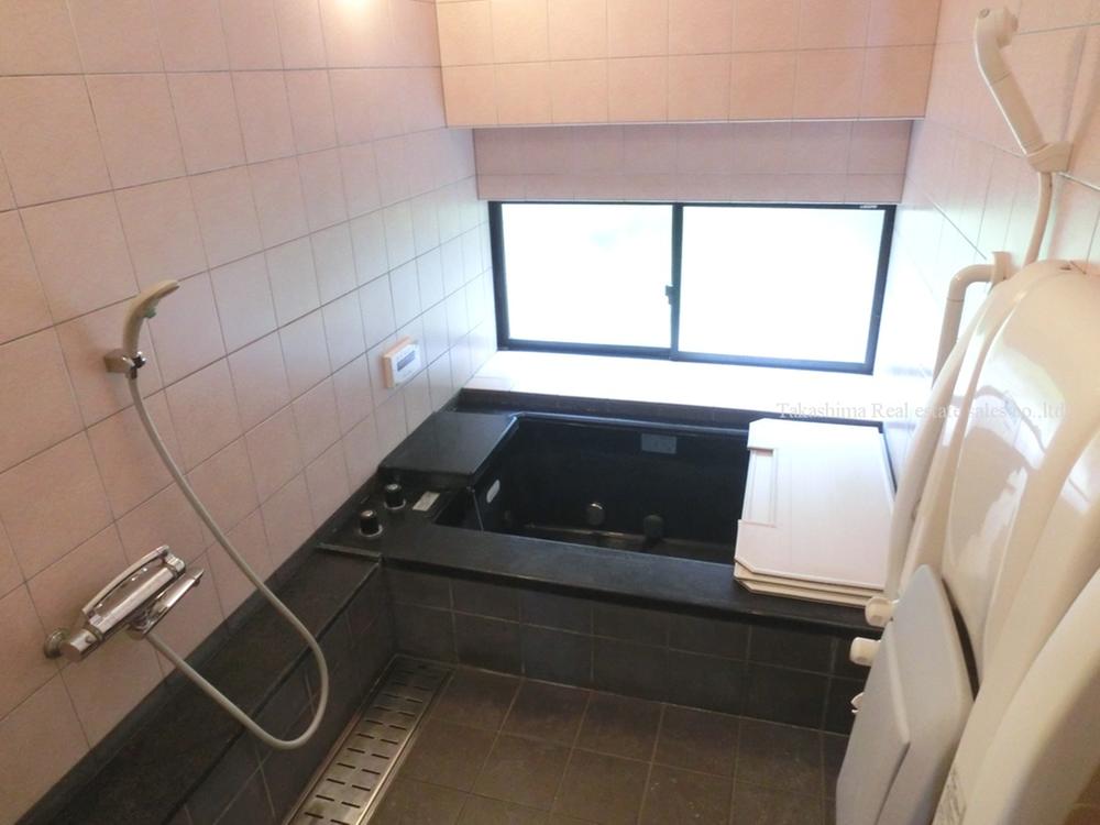 Bathroom. In the bathroom there is a large window.