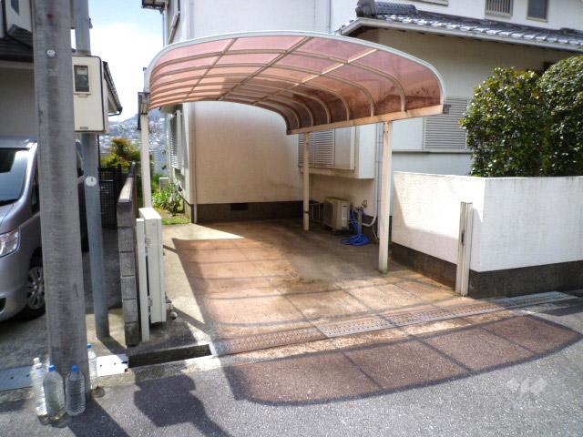 Parking lot. Parking spaces the property. Car port is attached.