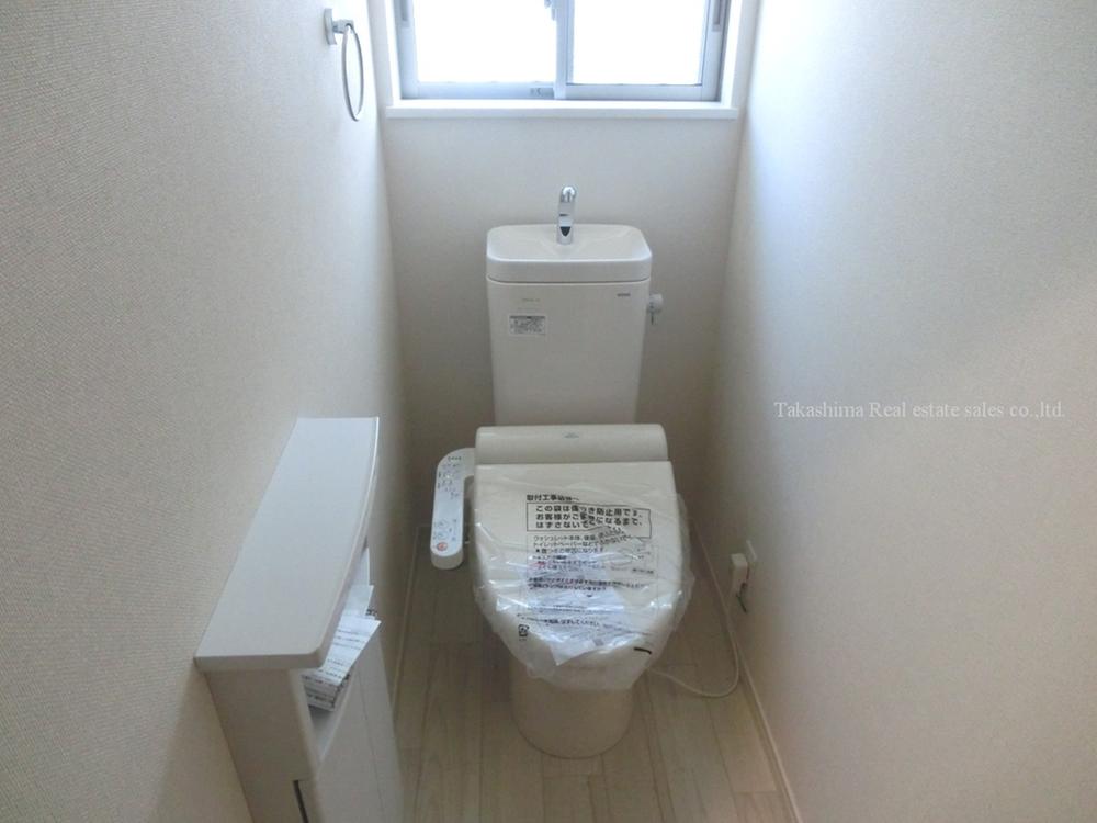 Toilet. Toilet with a small storage.