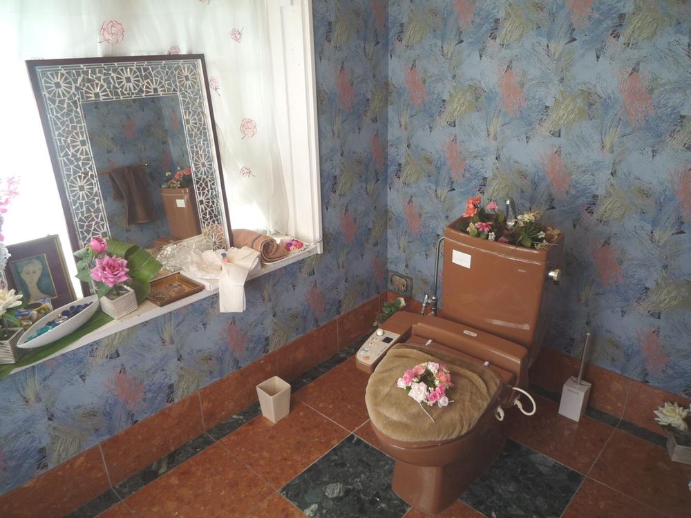 Toilet. There is a two-sided window is spacious and luxurious toilet