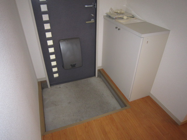 Entrance. With a shoe box