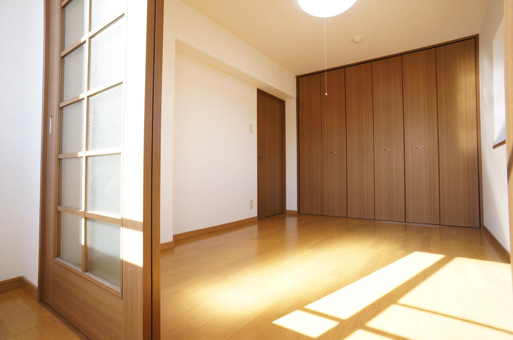 Living and room. With bay windows in the corner room, It is a bright room