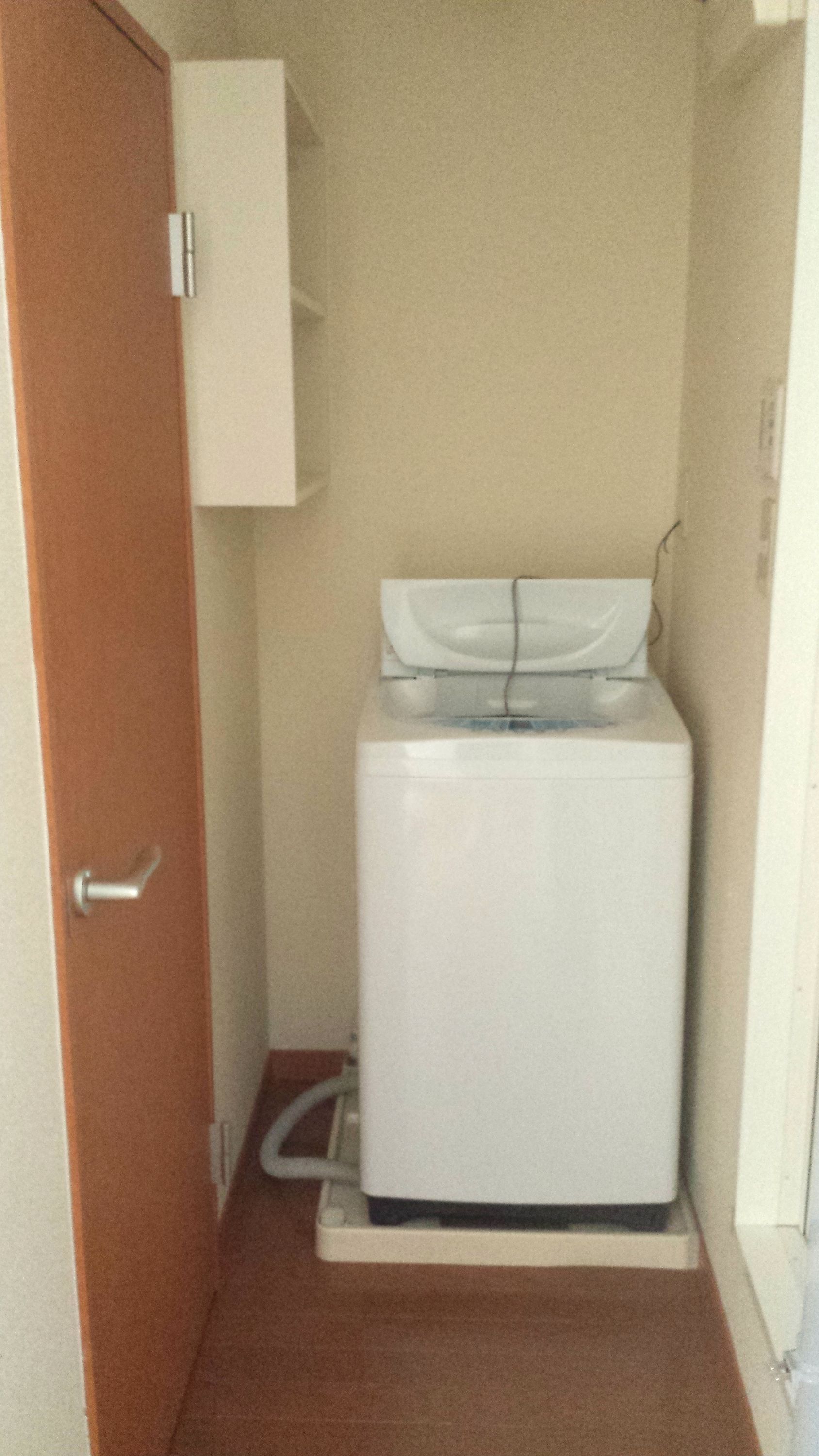 Washroom. Washing machine Storage