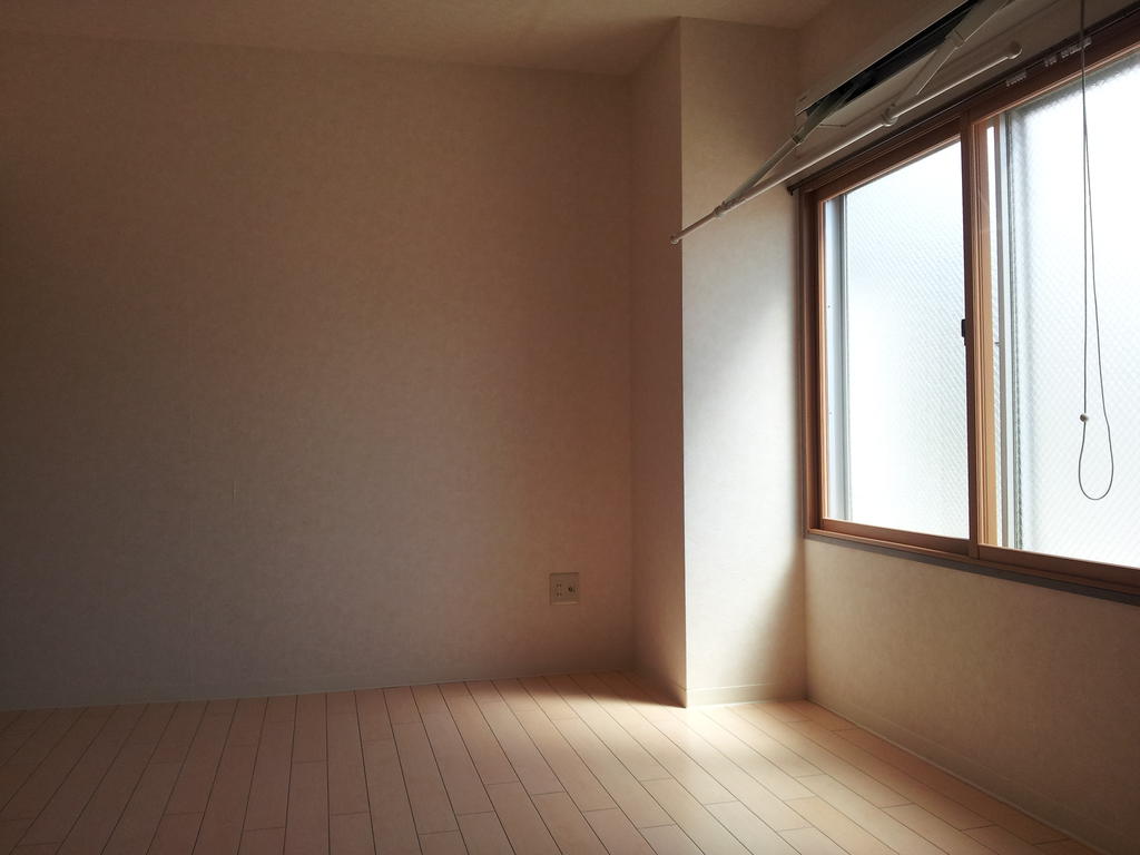 Living and room. With folding indoor clothes instrument in the window