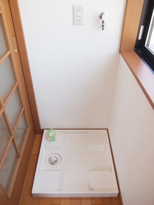 Other room space. Washing machine in the room