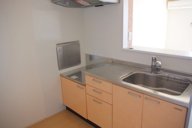 Kitchen. The photograph is a separate, Room