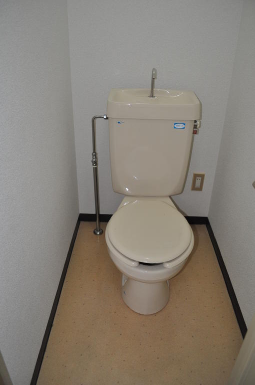 Toilet. Hot water washer attached to after the contract