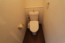 Toilet. With a happy warm water washing toilet seat