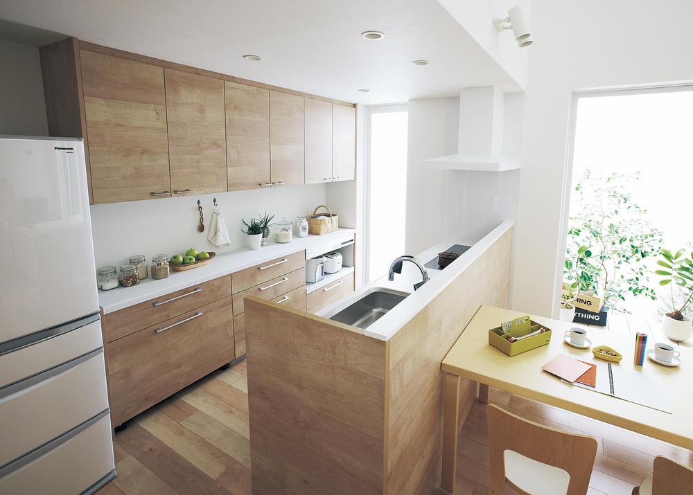 Kitchen. Panasonic "Living Station" use. Face-to-face kitchen to blend into living as furniture. Stain-resistant gap less sink sink eliminates the gap.