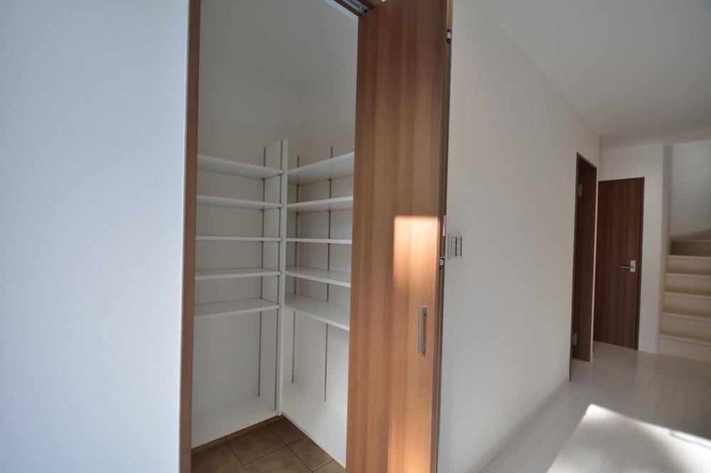 Receipt. Shoes cloak the entrance next to.