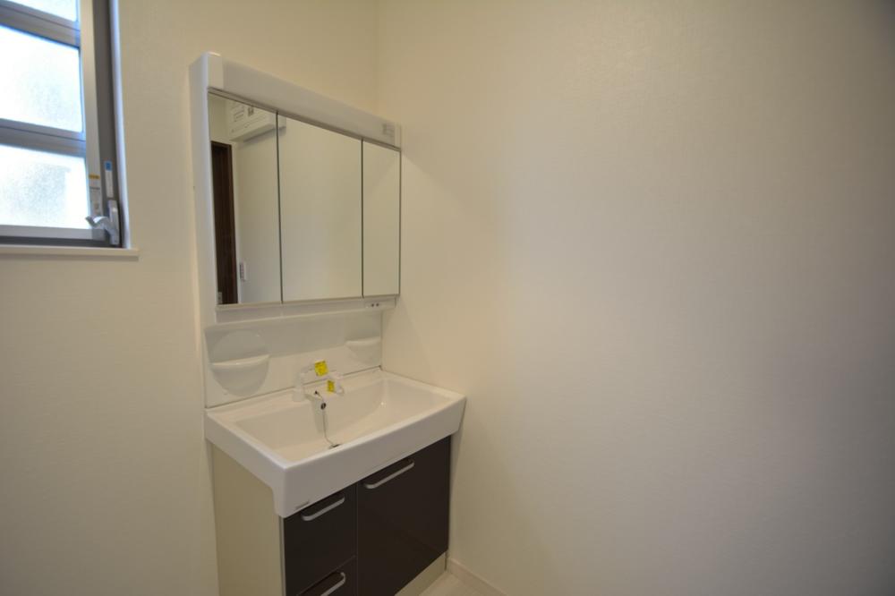 Wash basin, toilet. Washroom with a clean.