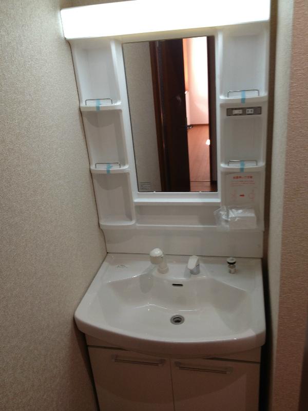 Wash basin, toilet. Wash basin is located in storage capacity!