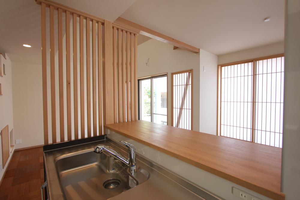 Building plan example (introspection photo). Overlooking the living room from the kitchen