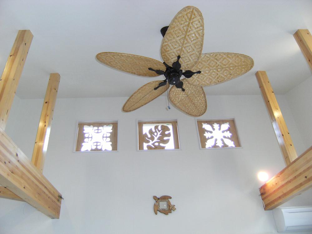 Building plan example (introspection photo). Bright living room of the slope ceiling of Hawaiian taste