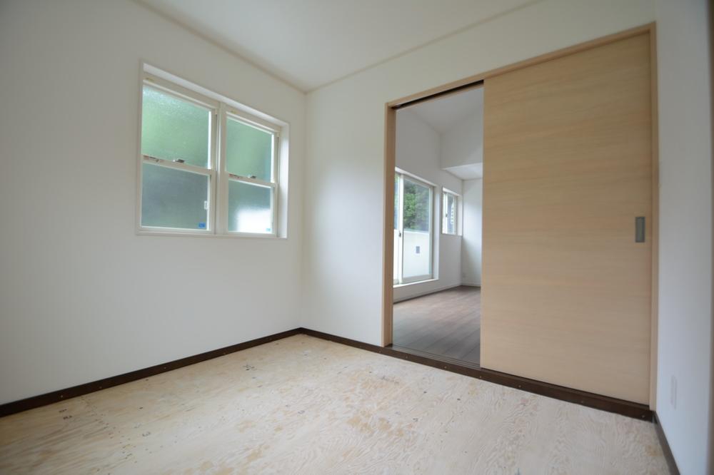 Non-living room. Japanese-style room leading to the living room.